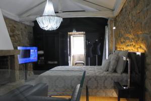 Un pat sau paturi într-o cameră la Casa do Largo do Cais