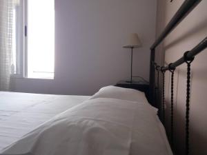 Letto o letti in una camera di Blue View