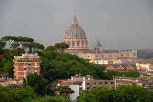 a view of a city with a cathedral and buildings at Arie Romane Guesthouse in Rome