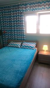 Łóżko lub łóżka w pokoju w obiekcie Apartment Joanna Grau de Gandia