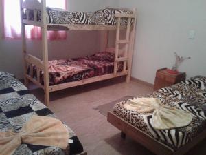 Divstāvu gulta vai divstāvu gultas numurā naktsmītnē Residencial Guadalupe