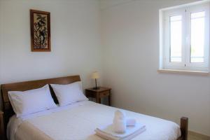 Postel nebo postele na pokoji v ubytování Casa da Maria Moca