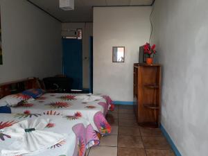 Postel nebo postele na pokoji v ubytování Hotel La Uvita