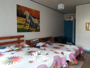Postel nebo postele na pokoji v ubytování Hotel La Uvita