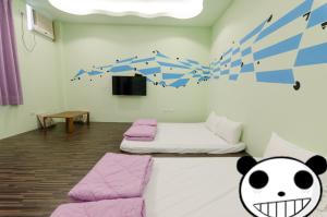Ένα ή περισσότερα κρεβάτια σε δωμάτιο στο Mu Yu B&B