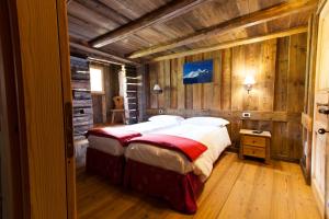 Postel nebo postele na pokoji v ubytování L' Aroula Rooms & Restaurant