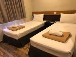 Voodi või voodid majutusasutuse Cebu R Hotel Capitol toas