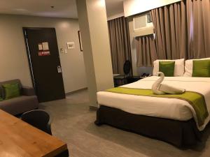 Voodi või voodid majutusasutuse Cebu R Hotel Capitol toas