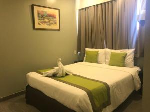 Voodi või voodid majutusasutuse Cebu R Hotel Capitol toas