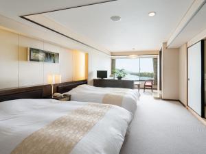 Letto o letti in una camera di Amano Hashidate Hotel