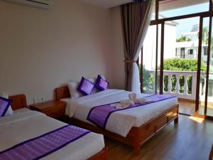 Postel nebo postele na pokoji v ubytování Ms Tri Homestay