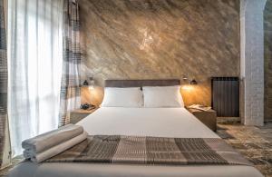 Кровать или кровати в номере StarHome Navona