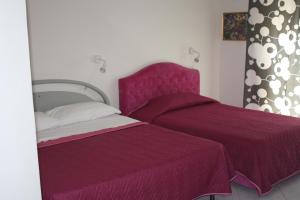 Postel nebo postele na pokoji v ubytování Sorrento Nest Rose