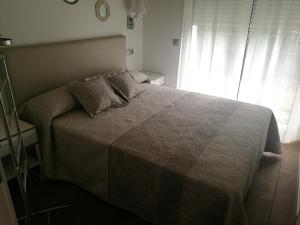 Postel nebo postele na pokoji v ubytování Apartamentos La Encina