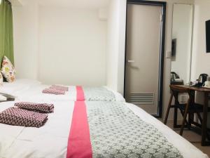 Postel nebo postele na pokoji v ubytování GreenHotel