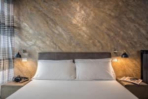 Кровать или кровати в номере StarHome Navona