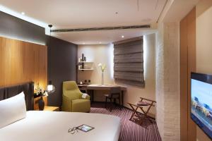 TV a/nebo společenská místnost v ubytování La Vida Hotel