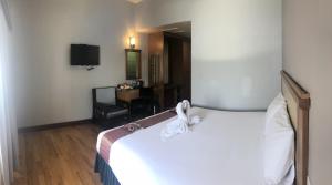 Postel nebo postele na pokoji v ubytování D-ONE Hotel