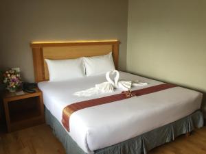 Postel nebo postele na pokoji v ubytování D-ONE Hotel