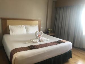 Postel nebo postele na pokoji v ubytování D-ONE Hotel