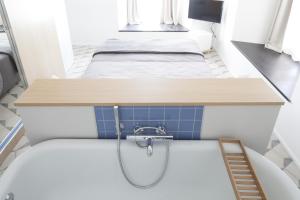 A bed or beds in a room at Genova Suite Art