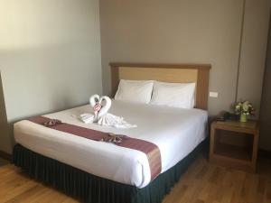 Postel nebo postele na pokoji v ubytování D-ONE Hotel