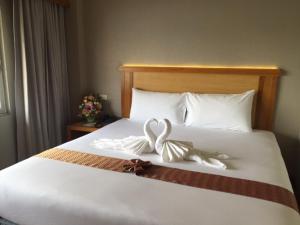 Postel nebo postele na pokoji v ubytování D-ONE Hotel