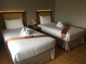 Postel nebo postele na pokoji v ubytování D-ONE Hotel