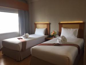 Postel nebo postele na pokoji v ubytování D-ONE Hotel