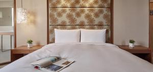 Katil atau katil-katil dalam bilik di Orange Hotel - Wenhua, Chiayi