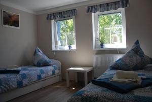Posteľ alebo postele v izbe v ubytovaní Apartment Ptačí Dům