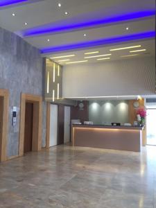 a lobby with a reception desk in a building at D-ONE Hotel in Hat Yai