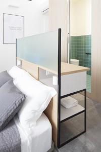 A bed or beds in a room at Genova Suite Art
