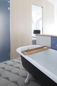A bed or beds in a room at Genova Suite Art