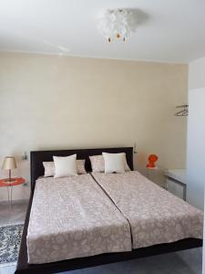 Ένα ή περισσότερα κρεβάτια σε δωμάτιο στο Residenza delle Grazie