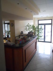 a lobby with a counter in a room at Albergo Italia in Ancona