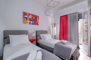Ένα ή περισσότερα κρεβάτια σε δωμάτιο στο Koukaki Central Apartment