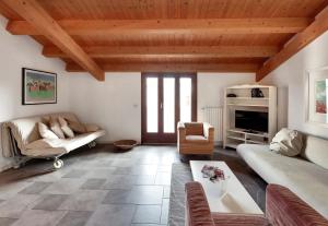 a living room with a couch and a table at siciliacasevacanze - La Mancina in Marina di Ragusa