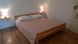 Postel nebo postele na pokoji v ubytování Apartment Kate