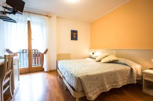 Voodi või voodid majutusasutuse Albergo Maggiorina toas