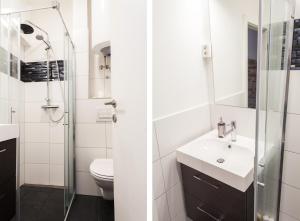 ein weißes Bad mit einem Waschbecken und einer Dusche in der Unterkunft Naja's apartments (apartment 1) in Koper
