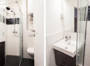 a white bathroom with a sink and a shower at Naja's apartments (apartment 1) in Koper