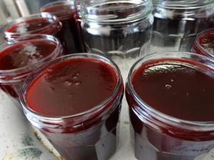 a group of mason jars filled with chocolate pudding at Chambres d'Hôtes de la Ferme Auberge de Mésauboin in Billé