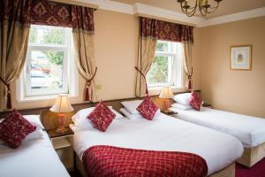Uma cama ou camas num quarto em Gabriel House Guesthouse