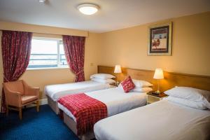 Uma cama ou camas num quarto em Gabriel House Guesthouse