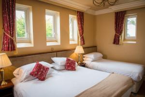 Uma cama ou camas num quarto em Gabriel House Guesthouse