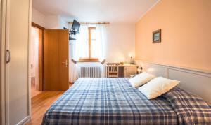 Voodi või voodid majutusasutuse Albergo Maggiorina toas