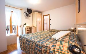 Voodi või voodid majutusasutuse Albergo Maggiorina toas