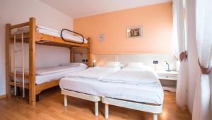 Voodi või voodid majutusasutuse Albergo Maggiorina toas