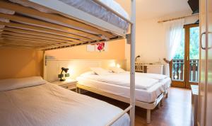 Voodi või voodid majutusasutuse Albergo Maggiorina toas